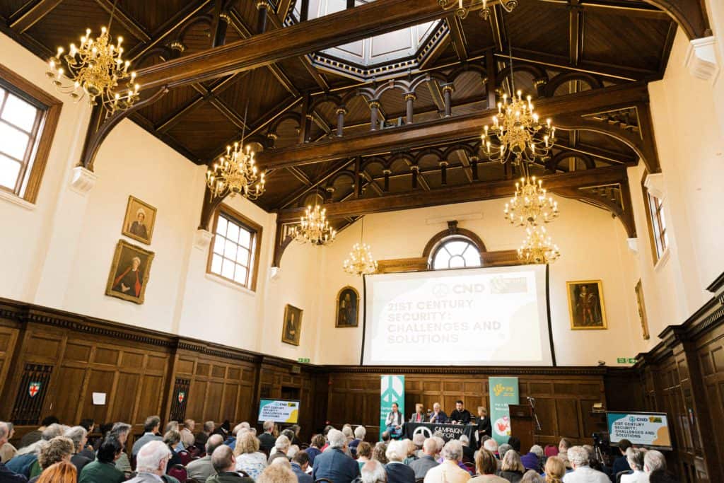 A photograph of the conference opening plenary session.