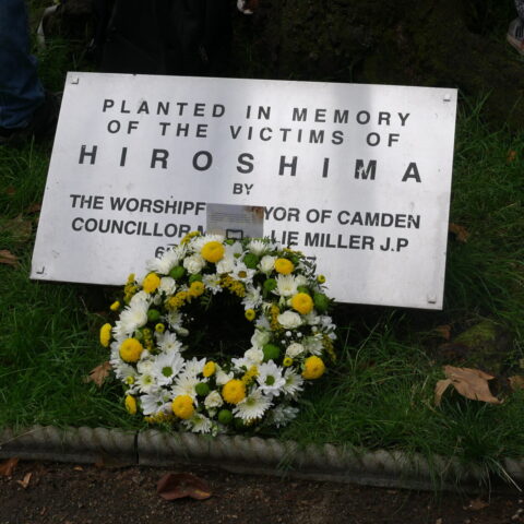 A wreath laid in front of a plaque commemorating the victims of the atomic bombing of Hiroshina